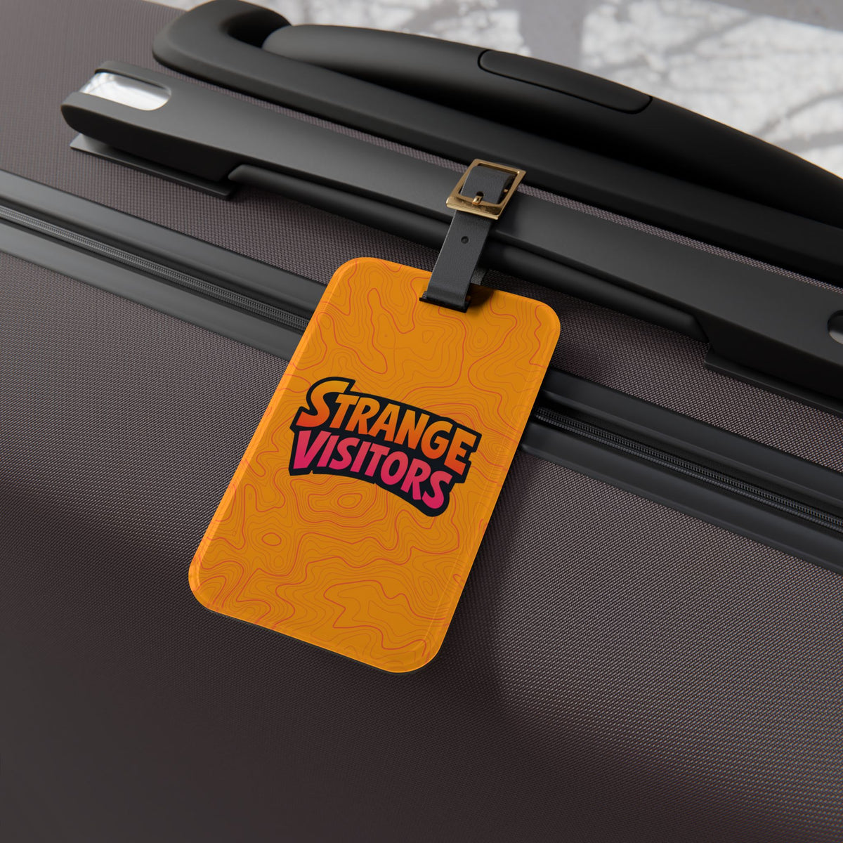 Strange Visitors Orange Luggage Tag — Bold Travel ID with Retro Logo